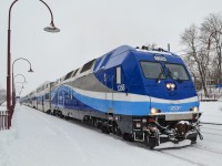 One of AMT's dual mode engines (operating in diesel mode only on this non-electrified line) leads a deadhead movement towards downtown Montreal. Pushing at the other end is another dual mode engine, AMT 1353. For more train photos, check out http://www.flickr.com/photos/mtlwestrailfan/ 