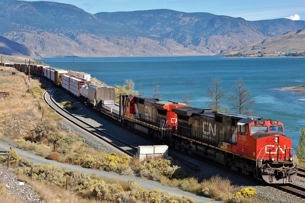 CN nos.2700&2121 have reached the west end of Kamloops Lake and are headed into the Thompson Valley at the head of this mixed freight.