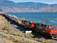 CN nos.2700&2121 have reached the west end of Kamloops Lake and are headed into the Thompson Valley at the head of this mixed freight.