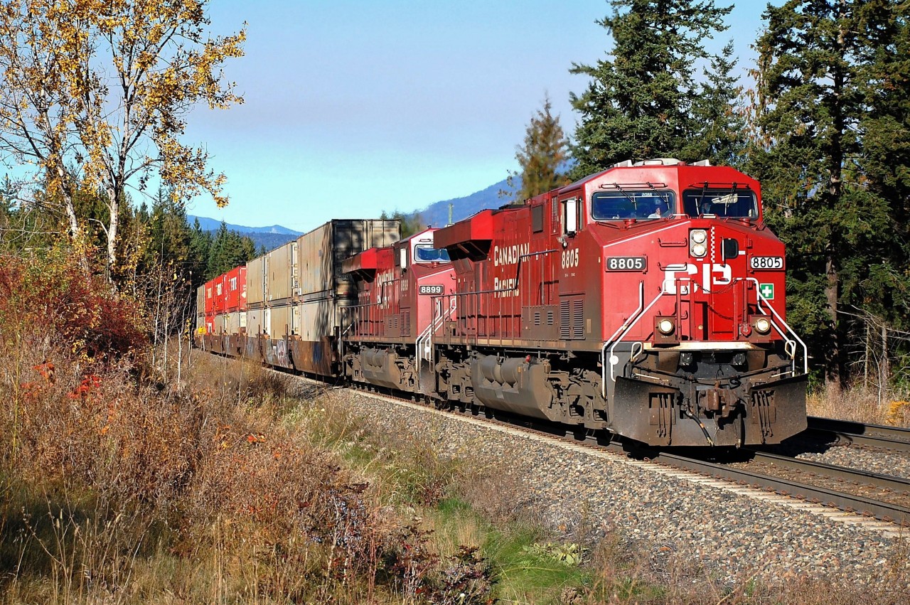 CP nos.8805&8899 are nearing Berton(Shuswap sub) on the south track in charge of an eastbound Intermodal. The sky shows the effects of slash burning in the area.
