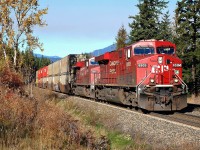 CP nos.8805&8899 are nearing Berton(Shuswap sub) on the south track in charge of an eastbound Intermodal. The sky shows the effects of slash burning in the area.