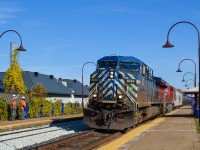 CEFX 1044 & CP 8911 head west through Valois Station with an empty unit train. To the left, a maintenance of way worker waves. For more train photos, check out http://www.flickr.com/photos/mtlwestrailfan/