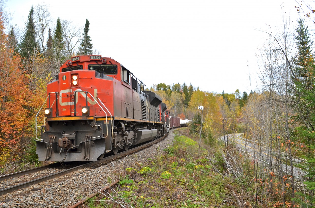 CN 369 heading south, led by CN 8834, CN 8851 & IC 2719. Operating mid-train was CN 5650 & CN 8893. This train weighed slightly over 13,000 tons. This is the scenic and up and down CN Lac St-Jean sub.
