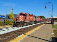 A ballast train very slowly heads west through Valois Station as it drops ballast. Power is CP 6020 & CP 5874, both with multimarks. At the rear is caboose CP 434957. CP has been doing a lot of trackwork this weekend on the Vaudreuil Sub, causing cancellation of commuter trains on this line. For more train photos, check out http://www.flickr.com/photos/mtlwestrailfan/