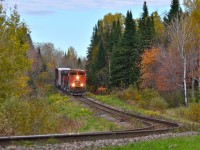 <b>Really downgrade!</b> CN 369 heads south on the scenic and up and down CN Lac St-Jean sub, led by CN 8834, CN 8851 & IC 2719. Operating mid-train was CN 5650 & CN 8893. This train weighed slightly over 13,000 tons. For more train photos, check out http://www.flickr.com/photos/mtlwestrailfan/