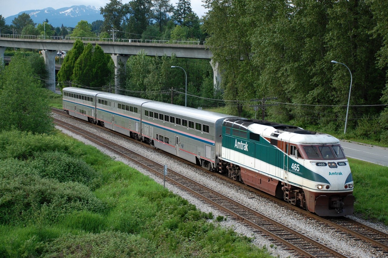 The 5:45pm Vancouver-Seattle Amtrak Cascades is passing Burnaby Lake Park behind AMTK 465.