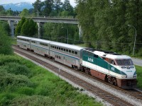 The 5:45pm Vancouver-Seattle Amtrak Cascades is passing Burnaby Lake Park behind AMTK 465.