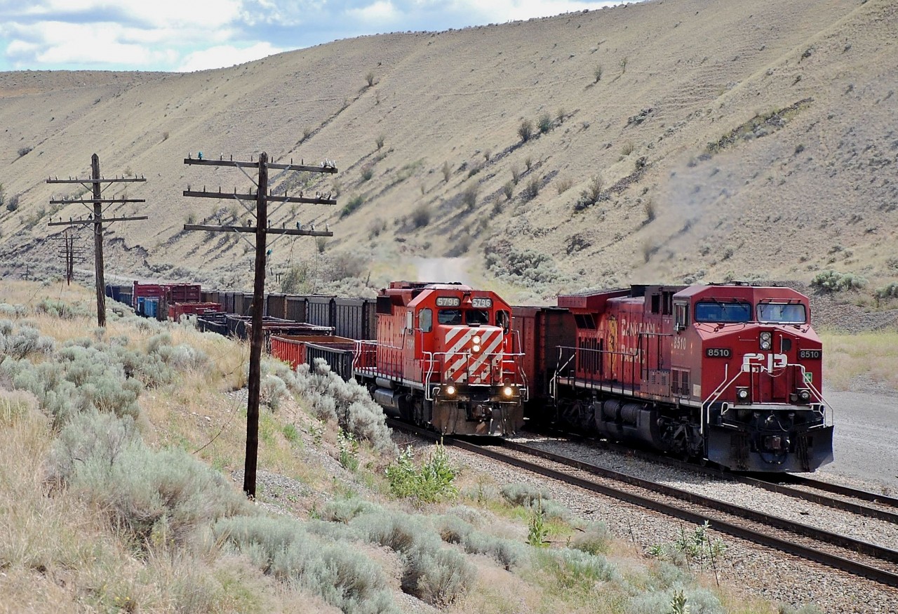 Ashcroft switcher CP 5796 is passing an eastbound empty coal train which has CP 8510 operating as the rear dp unit. This shot was taken just west of the rock quarry @Walhachin.