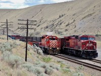 Ashcroft switcher CP 5796 is passing an eastbound empty coal train which has CP 8510 operating as the rear dp unit. This shot was taken just west of the rock quarry @Walhachin.