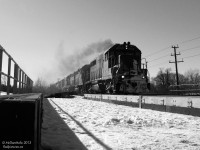 The whine of turbos spooling up and howl of 16 cylinder 645's breaks the silence of the nearby park as five (!) EMD GP's storm eastward over Fletcher's Creek with 90 carloads of interchange traffic for CN. This was just GEXR's normal #432, the "Mac N' Back" mainline run, which before the SD40 invasion got anywhere from 2 to 6 rag-tag GP38 and GP40's on a normal basis. The new bridge in the foreground is for the CN Halton Sub triple tracking project through Brampton, which eventually saw an extra mainline added between Bramalea and the Credit River for increasing GO service.
<br><br>
After sitting at Goderich out of service for years, 4046 was scrapped in 2013. Trailing units 4019, 4096, 3856, and 3835 eventually were sent to the Ottawa Valley Railway in North Bay, displaced by larger HLCX and GATX lease units that followed with motive power upgrading in later years.