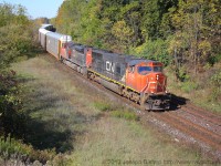 CN 332 makes its way through Paris and under the John Avenue Bridge with CN 5780 on the point.