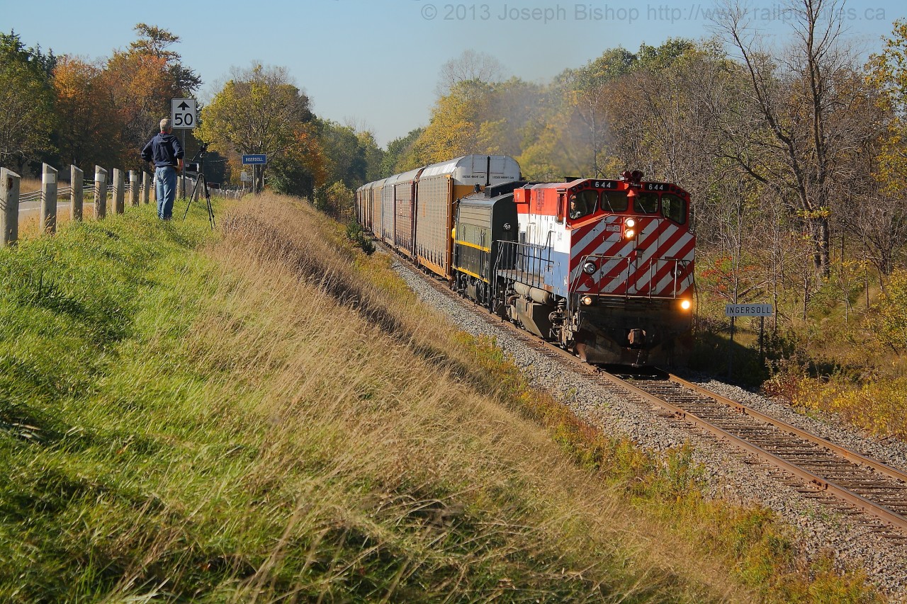 The OSR Woodstock Job clears the passing the Ingersoll sign on its way to Woodstock with OSRX 644 and OSRX 6508.  Fellow railfan James Adeney is seen further down the line capturing his video of the train.
