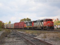 CN 5502 a rare SD50AF leads CN 148 by Brantford on a brisk fall day.