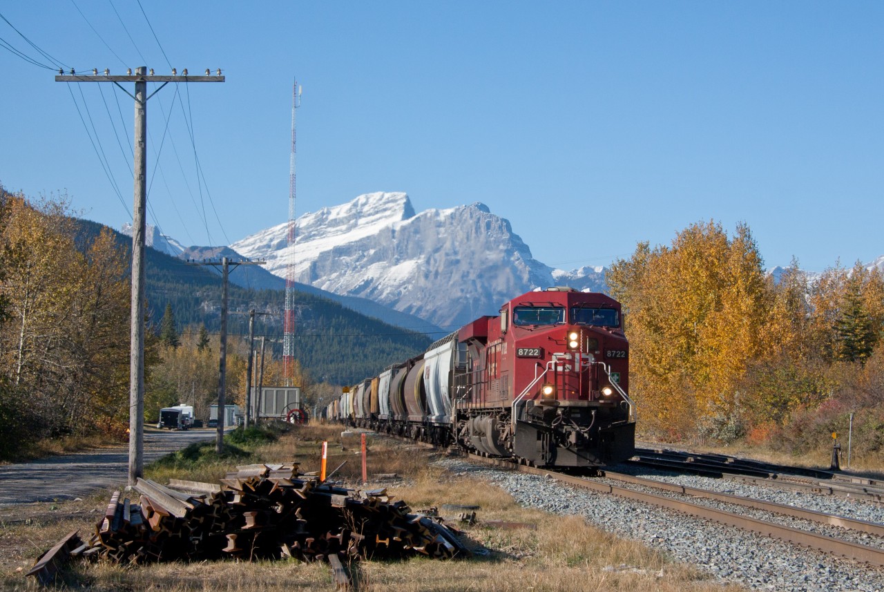8722 is accelerating out of Exshaw with grain empties after pausing momentarily to allow a westbound to take the siding further down the track. It would end up being a long day for this crew who further down the line had to take a siding too, but wait over two hours to proceed towards Calgary. I believe it's length was the reason. I never counted the cars but it sure was long.