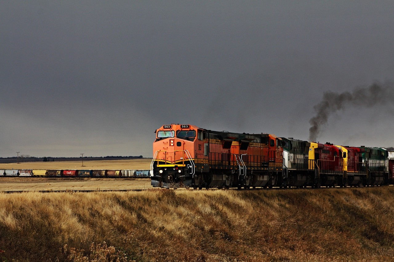 West of Limerick the GWR grainer to Assiniboia is making its way slowly but surely with Six units consisting of a pair of B40-8W's, M420W, two former Arkansas and Oklahoma B23-7's and another M420W. This train since departing Shaunavon Sk has seen a downpour, a blizzard and sunshine all in a matter of hours. With 25 miles left to go before putting the train away in the former CP yard they will make one last lift of two cars before getting the straight shot into town.