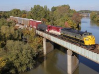 As a follow to Geoff Elliot's photo of the CP train in 2004, here is another shot of an F-unit in operation in post-2000 modern times, over the Thames River in Woodstock, ON. Here the OSR train is backing up into Coakley to lift a string of autoracks, left by CP 147 that just passed, and drop them off at Ingersoll. If it wasn't for the modern autoracks trailing, this could also be a scene from the 1960s!