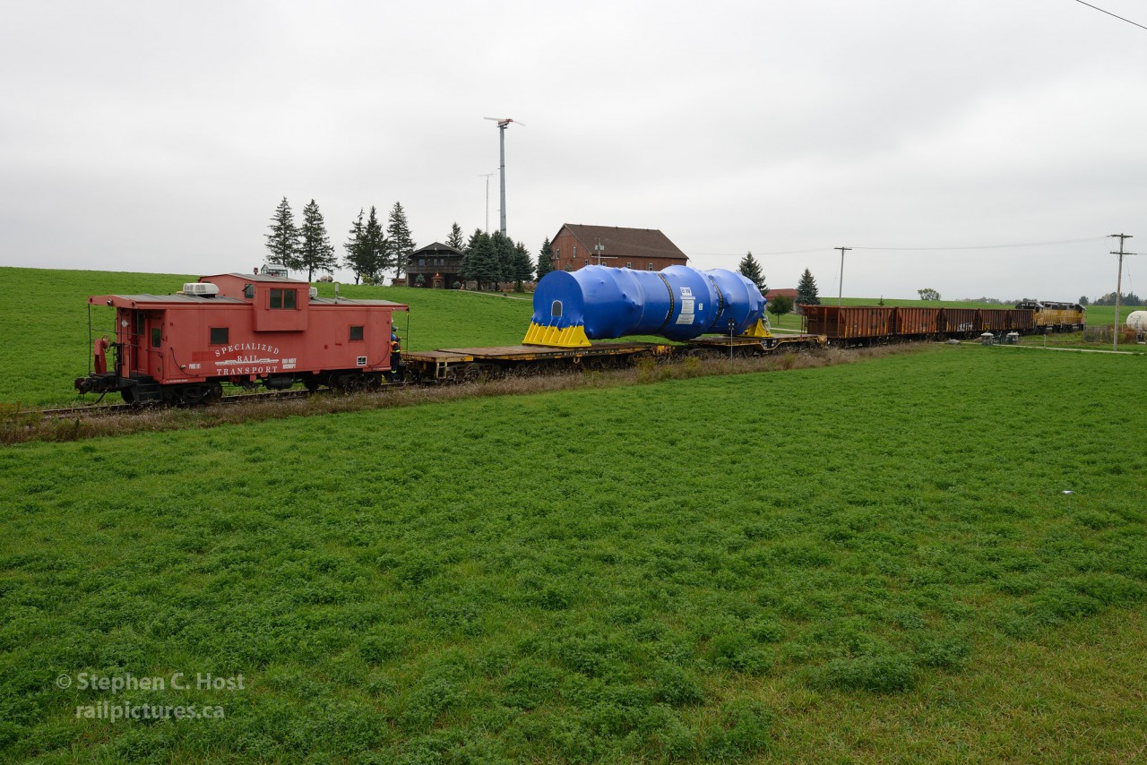 1,000,000+ lbs of steel are riding on 24 axles between two flat cars, five idlers, and two locomotives. Oh and a Caboose PHNX 101. Gross Weight, 505 tons. Destined to the Davis-Besse Nuclear Power Plant and shipped out of Babcock and Wilcox in Cambridge, Ontario. Made in Canada.