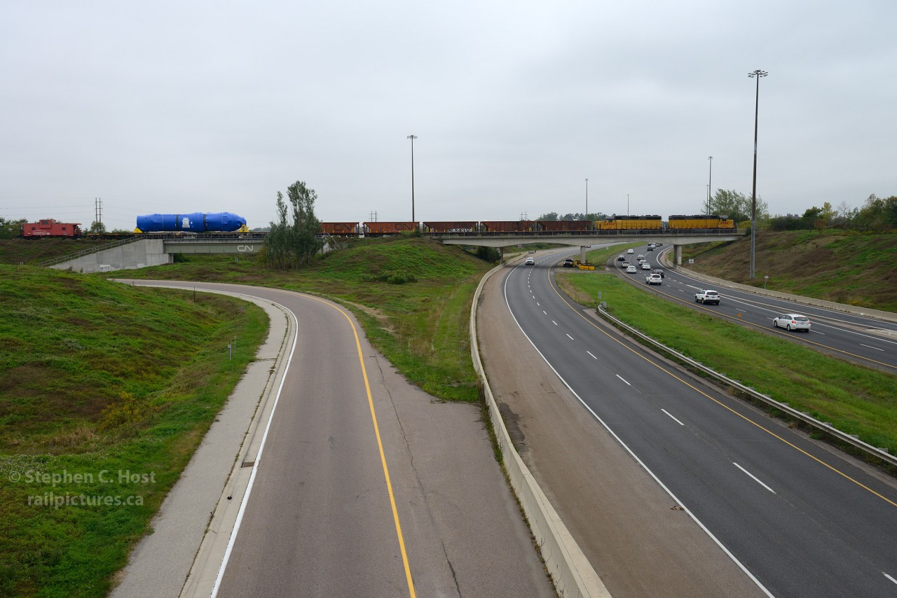 1,000,000+ lbs of steel are riding on 24 axles between two flat cars, five idlers, and two locomotives. Oh and a Caboose PHNX 101. Gross Weight, 505 tons. Destined to the Davis-Besse Nuclear Power Plant and shipped out of Babcock and Wilcox in Cambridge, Ontario. Made in Canada.