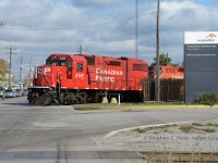 In the heart of industrial North Hamilton, we find the CPR Belt Line job working Westway. The tracks (right of way) in the Foreground, was once part of the Hamilton Radial Electric Railway Company and formed the line to Burlington, Ontario abandoned in '29, but still used today to service the heavy industry in the area.
