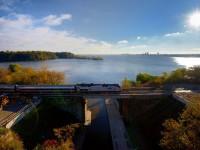 It almost seems as if everything is meeting at the historic Desjardins Canal this morning - Amtrak 194 on #97, the rays of the rising sun, CN Employees working on the GO Hamilton James St. North expansion project at left, and the waters of the Burlington Bay.