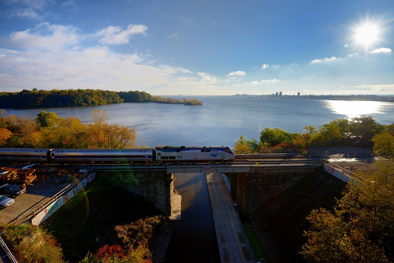 It almost seems as if everything is meeting at the historic Desjardins Canal this morning - Amtrak 194 on #97, the rays of the rising sun, CN Employees working on the GO Hamilton James St. North expansion project at left, and the waters of the Burlington Bay.