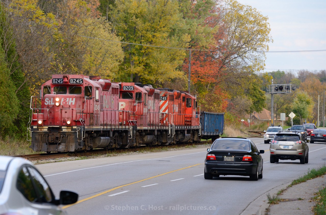 Interurban heritage is clearly evident at this location, on the former Grand River Railway, where the CPR Waterloo Subdivision runs beside King St. The Grand River Railway ran beside and inside many streets until about 1994, this is all that remains of beside-street running today. This location is mountain grade territory, 2% between mile 7 and mile 9... something tells me they made it up the hill today :)