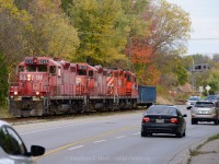 <b>Interurban</b> heritage is clearly evident at this location, on the former Grand River Railway, where the CPR Waterloo Subdivision runs beside King St. The Grand River Railway ran beside and inside many streets until about 1994, this is all that remains of beside-street running today. This location is mountain grade territory, 2% between mile 7 and mile 9... something tells me they made it up the hill today :)