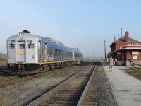 It’s shortly after 0900 on this Wednesday morning in White River, Ontario. VIA train 186 had to wait for a westbound on the mainline to clear; so the crew decided to use the passing track to board any passengers travelling east. Only two this morning: the gentleman with the camera strolling down the paved pathway and his friend who has already boarded. Both men are from North Carolina. They had overnighted in White River with the intention of taking the train to Sudbury today and returning back on VIA 185 tomorrow. 