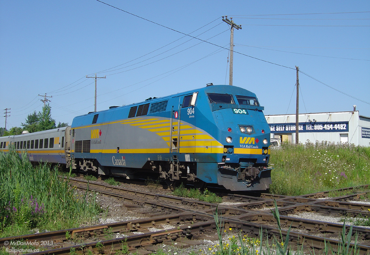 Slowing down in preparation for its station stop, VIA 904 rolls into town with train 84 from Sarnia, about to shatter the relative silence as it proceeds to "bang the diamond" before stopping at Brampton. The 5 LRC cars trailing 904 are full of passengers bound for Toronto, and the train will proceed express to Hogtown after making this one last stop in The Flower City.

Note the experimental bug deflectors, which were all the rage on a few of VIA's P42's for a while. They seemed to have vanished a number of years ago.