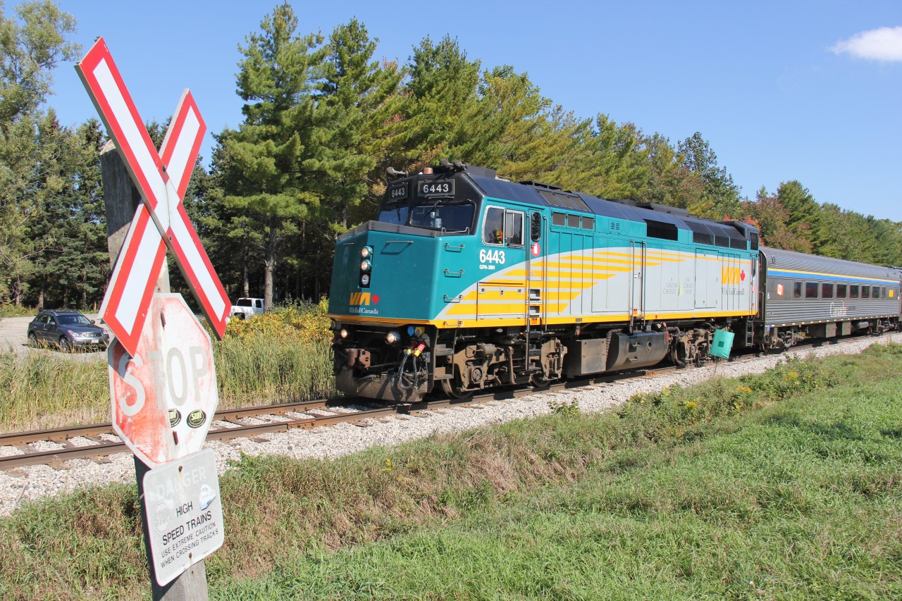VIA 85 obeys a slow order as it trundles past an sub-protected road crossing just west of Kitchener on the approach to the old Petersburg siding at the hamlet of Petersburg. The sign "Danger - High Speed Trains" does a great job at warning motorists!
