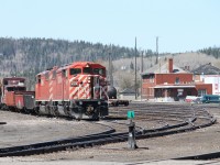 The crew on the CP work train have called it ‘a day’ and have returned with the train to the yard at White River. The crew had spent the day picking up old ties along the right-of-way to the west of White River on the Heron Bay subdivision. It is rare to see a pair of red barns, as in this instance with SD40-2F’s 9009 and 9008 paired together.