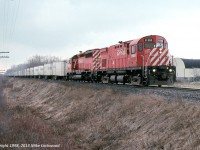 Being an east of Toronto guy, this is the only shot I took (that I remember at least) of the CP Roadrailer. I prefer my MLW's powered, but at least the 1100 looks nice enough. The Roadrailer's usual power trails, CP 6043, a unit that was recently tied up unservicable. 1405hrs.