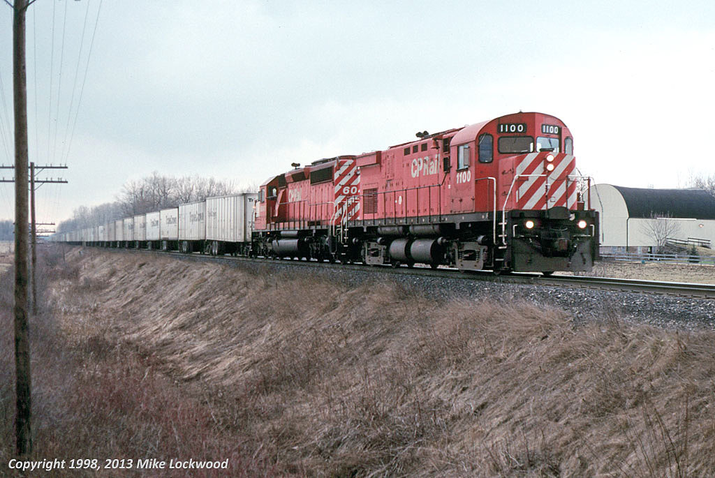 Being an east of Toronto guy, this is the only shot I took (that I remember at least) of the CP Roadrailer. I prefer my MLW's powered, but at least the 1100 looks nice enough. The Roadrailer's usual power trails, CP 6043, a unit that was recently tied up unservicable. 1405hrs.