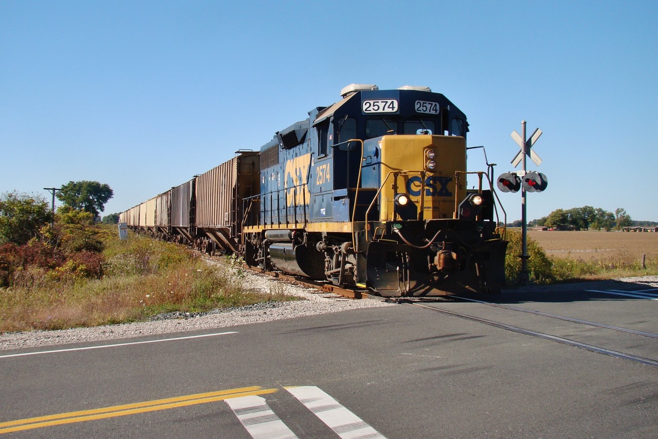 After picking up 12 loaded cars from Southwest Coop in Wallaceburg, CSX 2574 shoves his loads across Hwy 40 and all the way to Sombra, where he could finally run around his train to head back north to Sarnia. This was the last CSX move over these rails and now a short-line operator is being pursued to resume operations.
