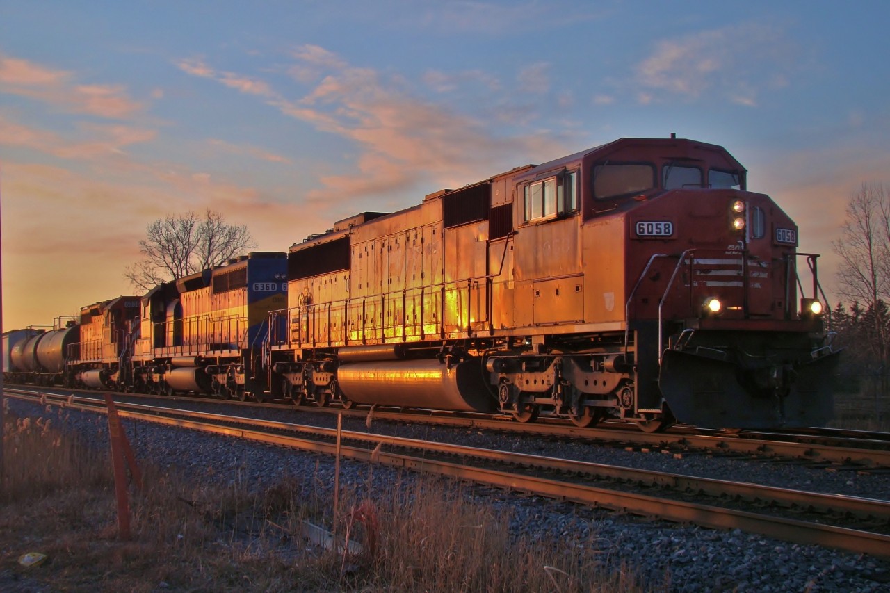 SOO 6058 leads two DME's out of Walkerville yard after doing some switching on a late February afternoon.