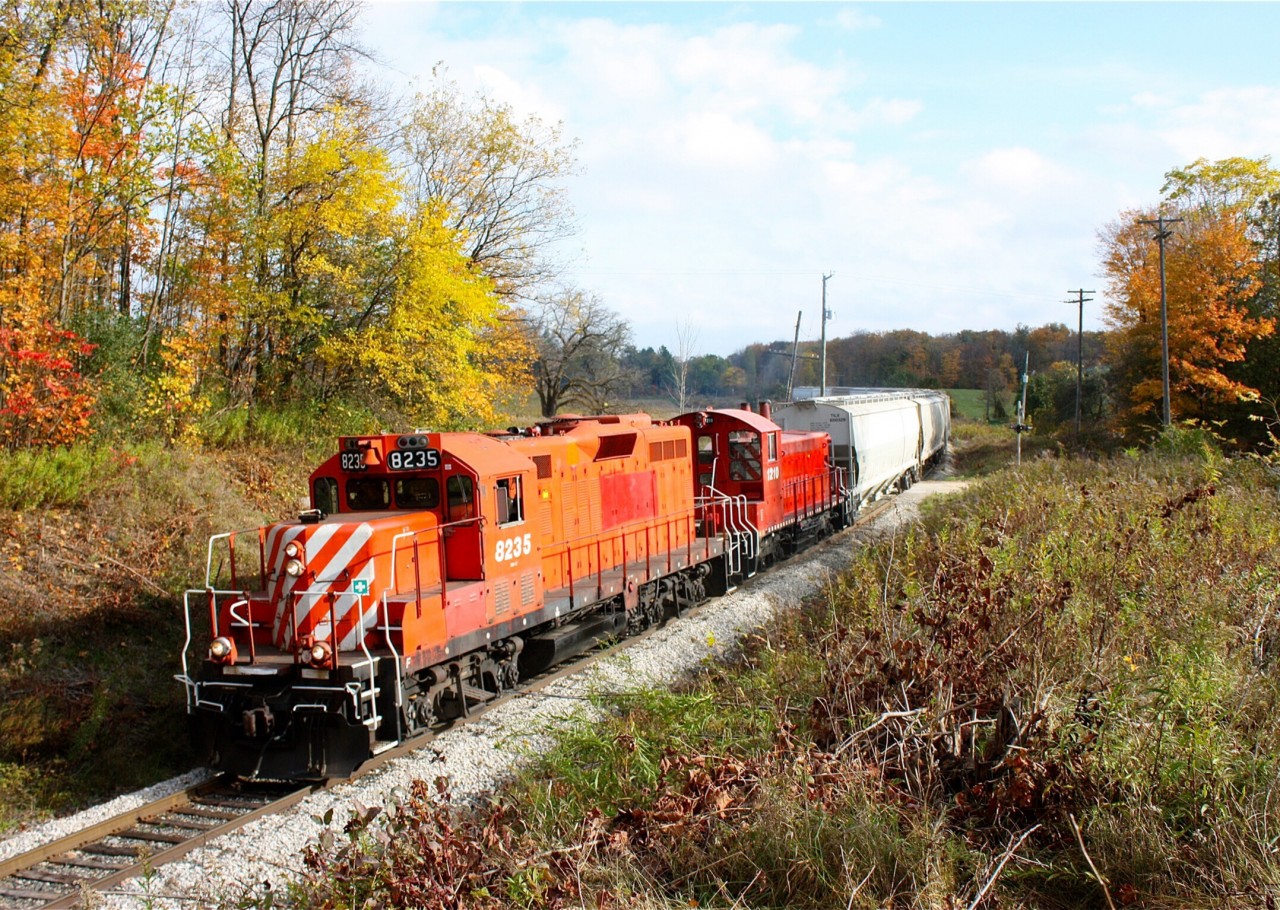 Former CPR first generation power making it look like old times on the former Goderich sub. OSR 8235 and 1210 roll through fading fall colours south of Corwhin on their way to Guelph.