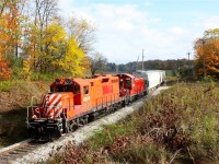 Former CPR first generation power making it look like old times on the former Goderich sub. OSR 8235 and 1210 roll through fading fall colours south of Corwhin on their way to Guelph.