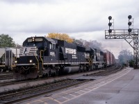 On a gray October day, a late NS 327 passes through Brantford with a long train of auto parts boxcars for St. Thomas.