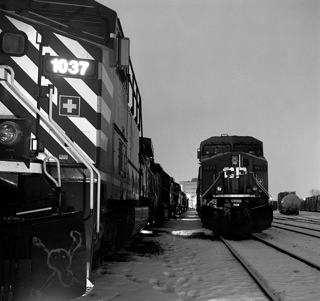 Christmas Eve 2005 finds whatever CP power the OVR had in its possession within or around North Bay tied up for the night in the OVR North Bay yard.  There were at least 12 units all idling away.  A railroader knew they were in downtown North Bay just by the smell of the diesel fumes hanging around, especially in the winter.  Over the last few years that has changed, with the "Bay" being a shadow of its former self, as far as railways are concerned.  (Note the skull and crossbones on the plow of the 1037)