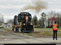 <B>New railway, old power!</B> In late 2012, a new railway was born in the La Beauce region ; Chemin de fer Sartigan. They bought their first engine, an MLW RS18u, in January 2013 from Durbin and Greenbrier Valley Railroad. Originally, that RS18u was in the CP roster when that engine was built in July 1958. Here, on the picture, 55 years later, the old warrior smokes a nice puff while the conductor protect the crossing with a red flag. <BR><BR>See the little history of that engine... Nee-CP 8793, exxxx-CP 1828, exxx-OCRR 1828, exx-GRYR 1828, ex-DGVR 1828, now CFS 1828.