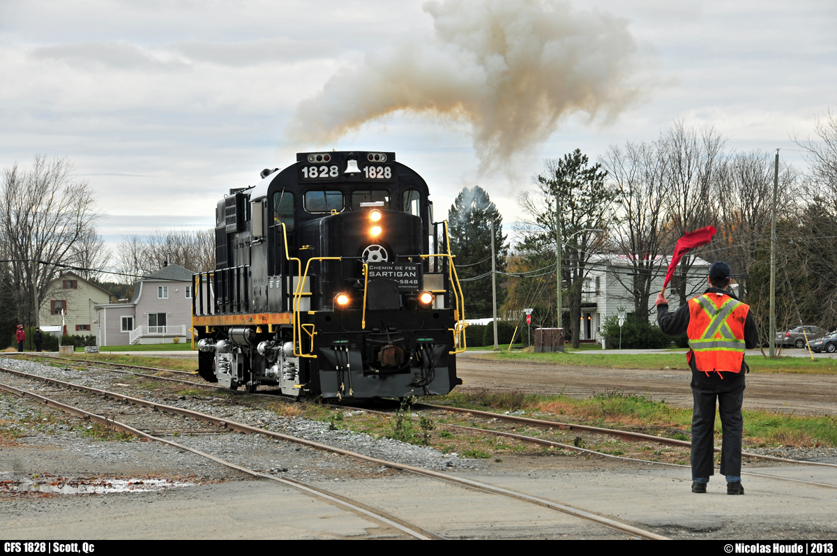 New railway, old power! In late 2012, a new railway was born in the La Beauce region ; Chemin de fer Sartigan. They bought their first engine, an MLW RS18u, in January 2013 from Durbin and Greenbrier Valley Railroad. Originally, that RS18u was in the CP roster when that engine was built in July 1958. Here, on the picture, 55 years later, the old warrior smokes a nice puff while the conductor protect the crossing with a red flag. 


See the little history of that engine... Nee-CP 8793, exxxx-CP 1828, exxx-OCRR 1828, exx-GRYR 1828, ex-DGVR 1828, now CFS 1828.