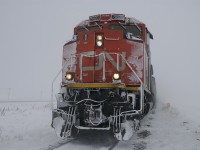 With winter just around the corner I thought this pleasant image might put people in the mood for some winter railfanning. Although to be fair this was not a day of railfanning but rather a cold day at the office. I was called as the cndr on a 313 relief crew out of North Battelford SK after it needed to double the hill just west of town. This shot is taken after doubling together the sections and walking up 60 or so car lengths only to find out that we were still not charged up enough to pull yet. So before taking off the winter gear I figured I would grab a photo of the lovely weather, the lovely weather that is soon to return.  