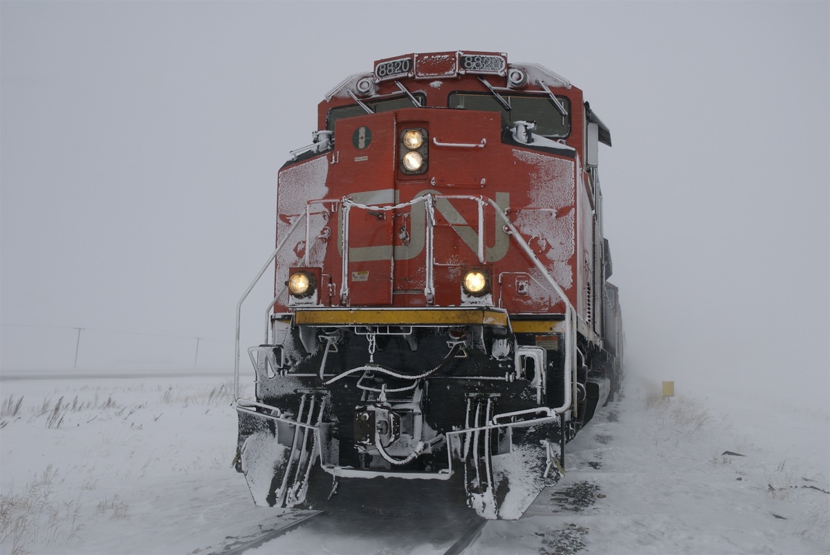 With winter just around the corner I thought this pleasant image might put people in the mood for some winter railfanning. Although to be fair this was not a day of railfanning but rather a cold day at the office. I was called as the cndr on a 313 relief crew out of North Battelford SK after it needed to double the hill just west of town. This shot is taken after doubling together the sections and walking up 60 or so car lengths only to find out that we were still not charged up enough to pull yet. So before taking off the winter gear I figured I would grab a photo of the lovely weather, the lovely weather that is soon to return.