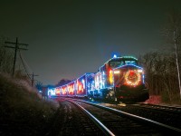 The US Holiday Train sits at Guelph Junction East for the passage of CP 247 who's on a long sluggish climb up the Hamilton Subdivision.