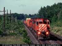 CP M630 #4570 has 2 sister Alcos and train #506 well in hand as it rolls through eastern Ontario just east of Kemptville on July 5, 1993.