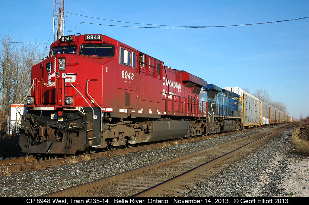 CP Train #325-14 with CP 8948 and CEFX 1033 waits patiently in the siding at Belle River for a 10,000 foot plus 142 to pass by before continuing on to Windsor.