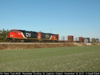 CN 4761, in fresh paint, leads CN train #439 toward Windsor as is passes over the Rochester Townline near St. Joachim, Ontario on a beautiful, sunny November day.