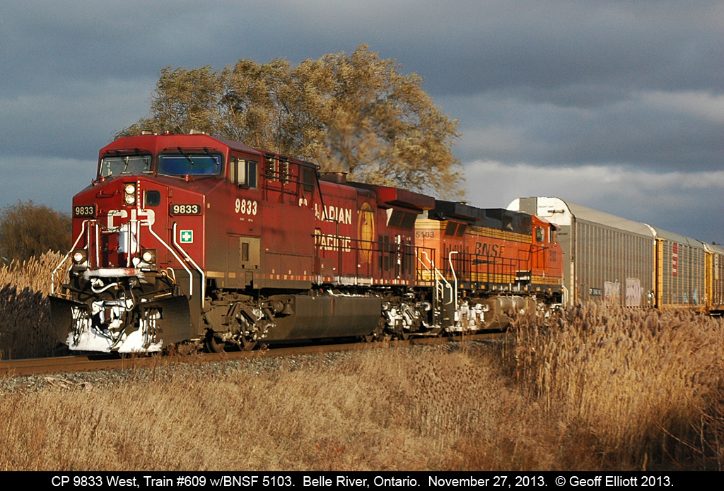 CP 9833 has BNSF 5103 trailing on 609-326 as it comes into the sunlight from what had to be the smallest sucker hole ever!!!  609 doesn't look like an empty ethanol train with 21 autoracks on the point but he has 100 empty tanks following. BIG train with cool power.......