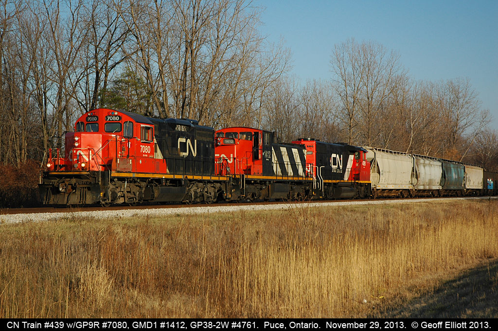 In what can be described as an "only on CN" lashup we have CN GP9r #7040, GMD1 #1412, and GP38-2W #4761 leading a short CN #439 train through Puce, Ontario on November 29, 2013.  Talk about a 'classic' CN lashup!!