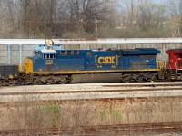 CSX D718 is seen here switching CN's Electric Yard after dropping off interchange cars for CN and The Essex Terminal Railway. This shot is taken from a berm that follows alongside the yard. The former CASO main is seen in the bushes near the bottom of the photo.